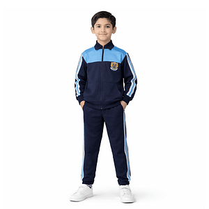 Boy in navy school tracksuit uniform with sky-blue shoulder panels and side stripes, full-zip jacket and track pants